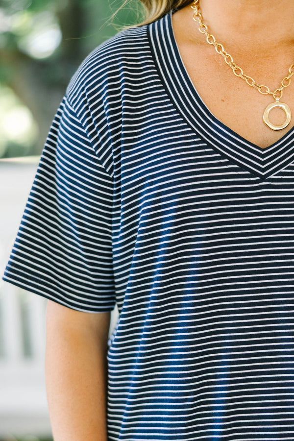 Plus Size navy and white horizontal striped V-neck top with short sleeves and a relaxed fit.
