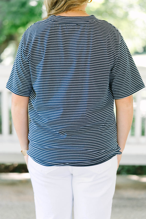 Plus Size navy and white horizontal striped V-neck top with short sleeves and a relaxed fit.