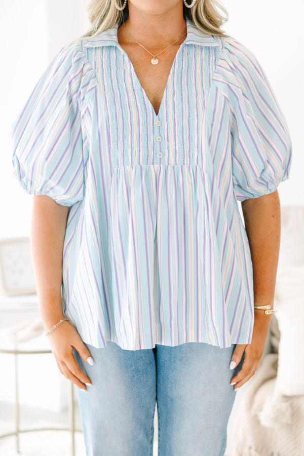 Plus Size blue striped top with a v-neck, collar, smocked front, and short bubble sleeves.