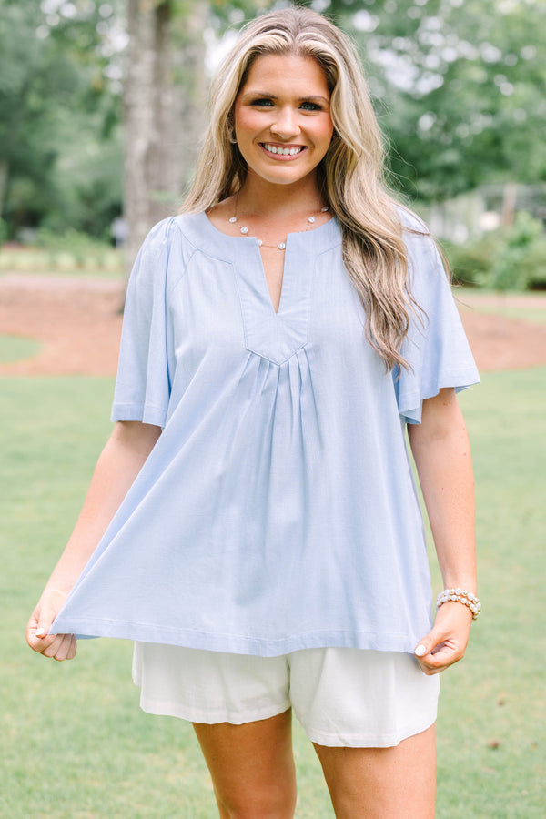 Plus Size light blue short sleeve top with a split neckline and pleated front detail.