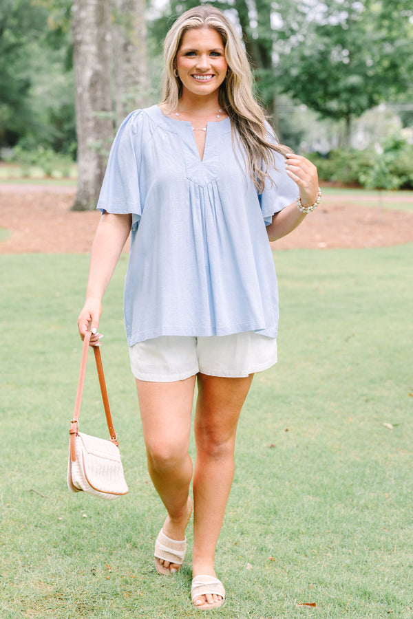 Plus Size light blue short sleeve top with a split neckline and pleated front detail.