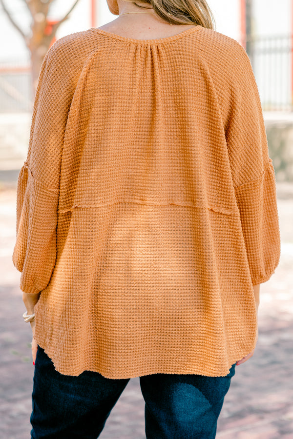 Chic Soul plus size clothing, rust colored baby doll top with buttons going down to the chest and three quarter inch bubble sleeves 