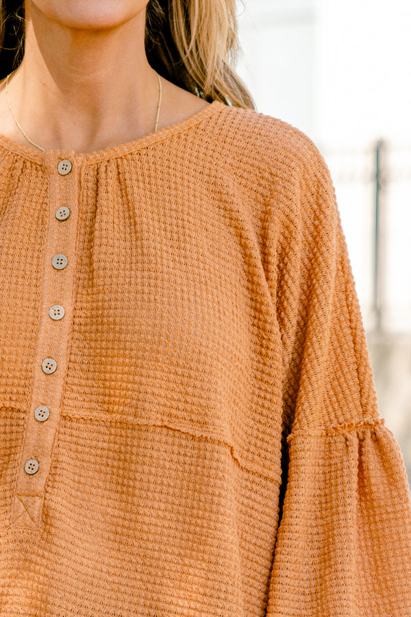 Chic Soul plus size clothing, rust colored baby doll top with buttons going down to the chest and three quarter inch bubble sleeves 