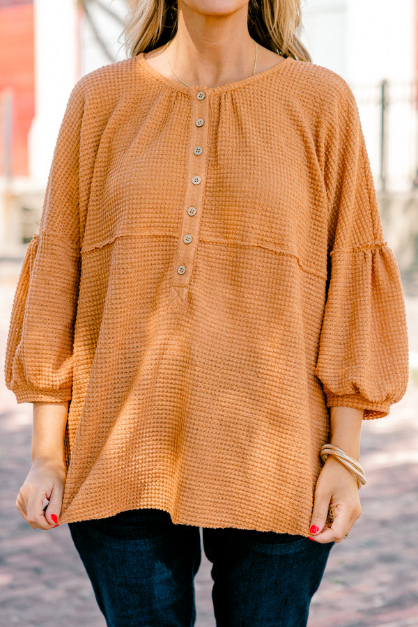 Chic Soul plus size clothing, rust colored baby doll top with buttons going down to the chest and three quarter inch bubble sleeves 