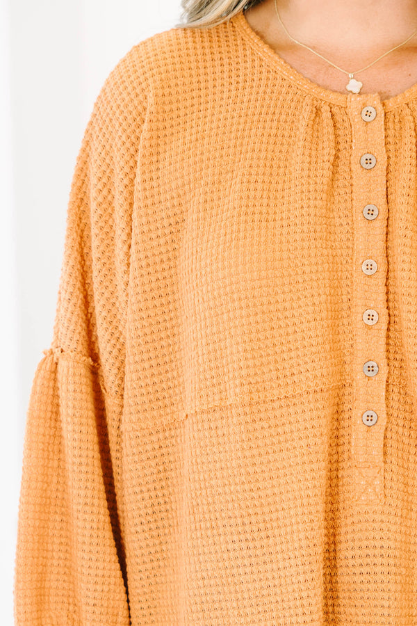 Chic Soul plus size clothing, rust colored baby doll top with buttons going down to the chest and three quarter inch bubble sleeves 