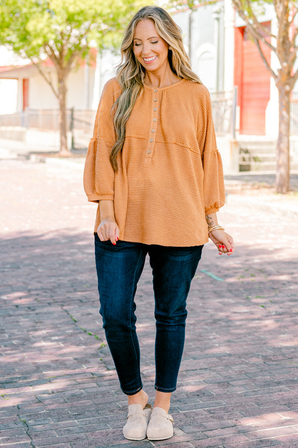 Chic Soul plus size clothing, rust colored baby doll top with buttons going down to the chest and three quarter inch bubble sleeves 