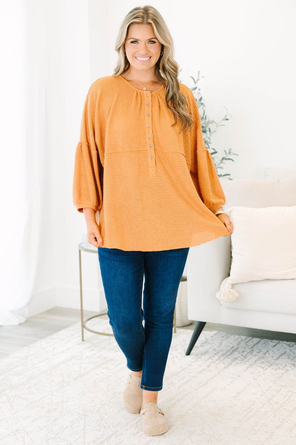 Chic Soul plus size clothing, rust colored baby doll top with buttons going down to the chest and three quarter inch bubble sleeves 