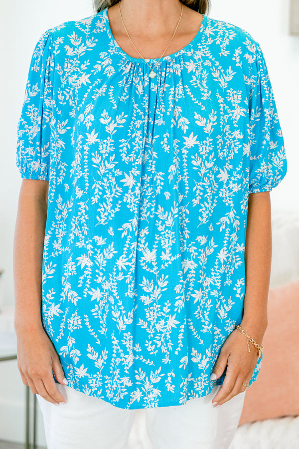Chic Soul plus size clothing, short sleeve aqua top with white floral pattern and smocked scoop-neckline