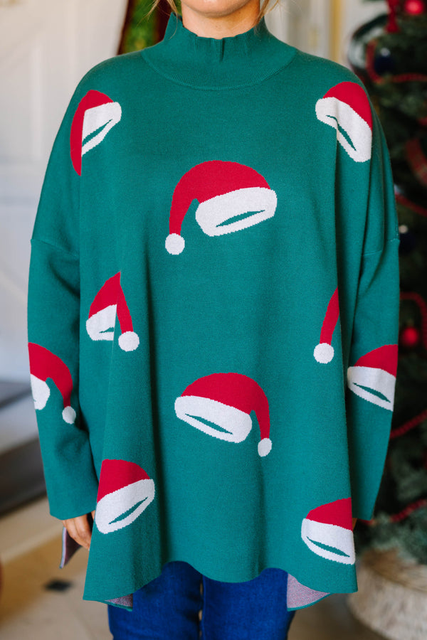 Plus Size green oversized tunic sweater with a mock neck and knit red and white Santa hat patterns.