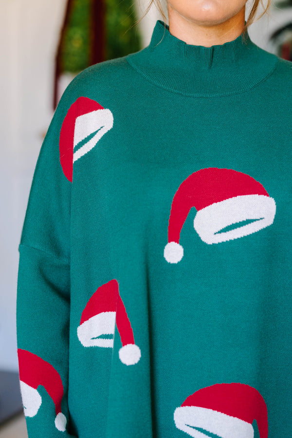 Plus Size green oversized tunic sweater with a mock neck and knit red and white Santa hat patterns.
