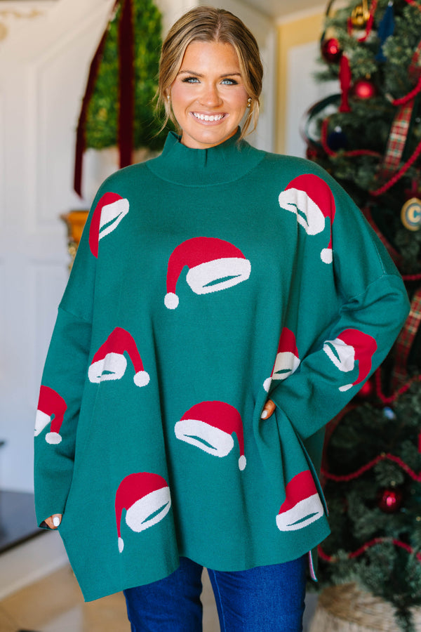 Plus Size green oversized tunic sweater with a mock neck and knit red and white Santa hat patterns.