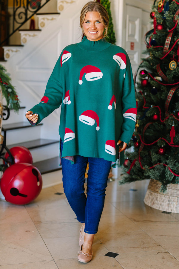 Plus Size green oversized tunic sweater with a mock neck and knit red and white Santa hat patterns.