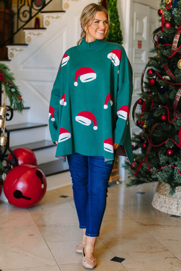 Plus Size green oversized tunic sweater with a mock neck and knit red and white Santa hat patterns.