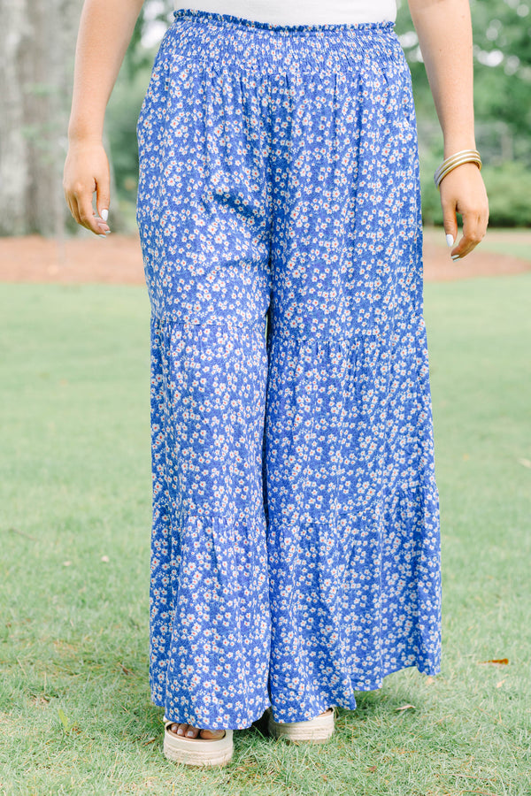 Plus Size blue floral wide-leg tiered pants with a smocked waistband and ditsy flower print.