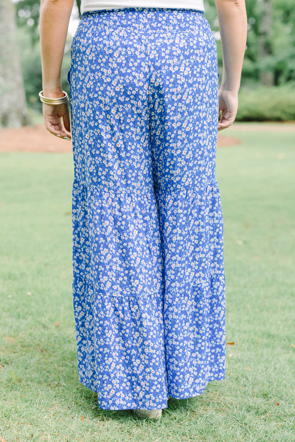 Plus Size blue floral wide-leg tiered pants with a smocked waistband and ditsy flower print.