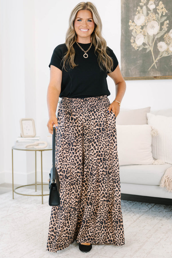 Plus Size wide-leg tiered pants in a dark leopard print with a smocked elastic waistband.