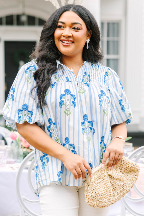Chic Soul plus size clothing, blue striped top with bubble sleeves a slight v-neckline and a blue floral block print. 