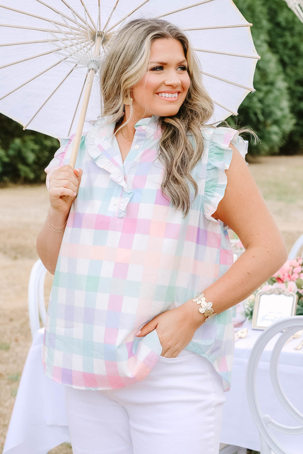 Chic Soul plus size clothing, white top with flutter sleeves and ruddle details going around the v-neckline as well as a pastel faded gingham pattern throughout 
