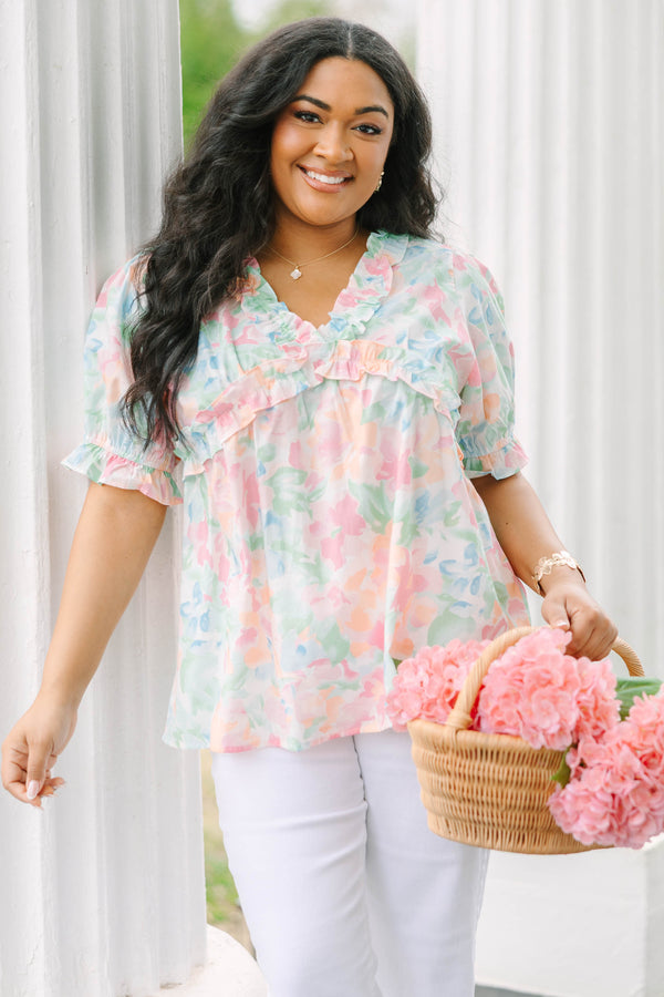 Chic Soul plus size clothing, peach floral top with short sleeves that have a cuffed ruffle detail on the bottom of both sleeves as well as ruffle details outlining the v-neckline and going under the chest area 
