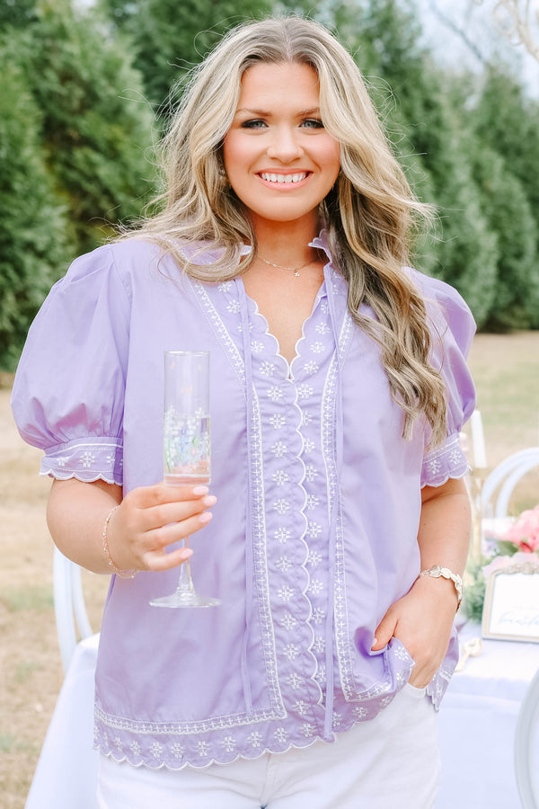 Chic Soul plus size clothing, lavender top with white stitched circle pattern on the bottom of the sleeves outlining the v-neckline going down the center of the shirt and going along the bottom of the shirt as well as bubble sleeves that have a scalloped cuff on the bottom of each sleeve 