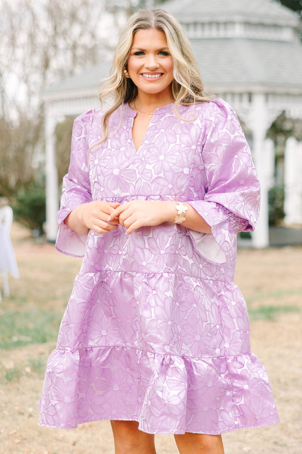 Chic Soul plus size clothing, periwinkle tiered knee length dress with half sleeves that have a ruffle detail at he end of each sleeve as well as a floral pattern 