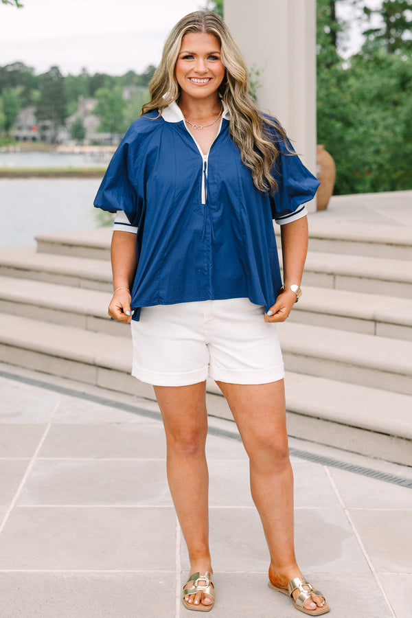 Plus Size navy blue quarter-zip top with white collar, puff sleeves, and white shorts.