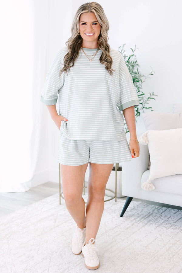 Plus Size sage green and white striped loungewear set with a short-sleeve top and matching shorts.