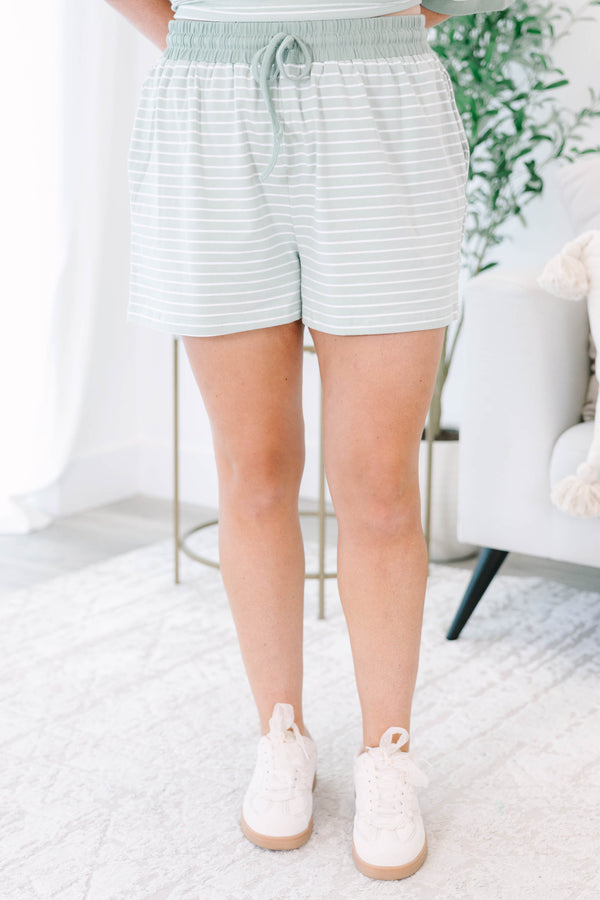 Plus Size sage green and white striped loungewear set with a short-sleeve top and matching shorts.