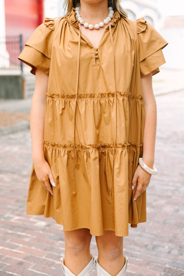 Plus Size tiered brown babydoll dress with flutter sleeves, a ruffled neckline, and tie details.