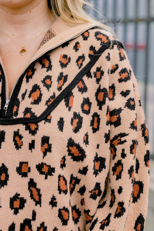 Chic Soul plus size clothing, leopard long sleeve that has a zipper going down to the chest as well has black stitching details around the bottom of the sweater and along the neckline 