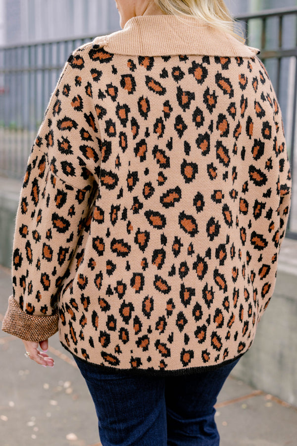 Chic Soul plus size clothing, leopard long sleeve that has a zipper going down to the chest as well has black stitching details around the bottom of the sweater and along the neckline 