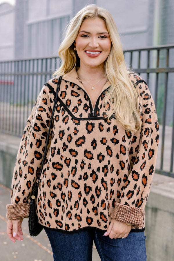 Chic Soul plus size clothing, leopard long sleeve that has a zipper going down to the chest as well has black stitching details around the bottom of the sweater and along the neckline 