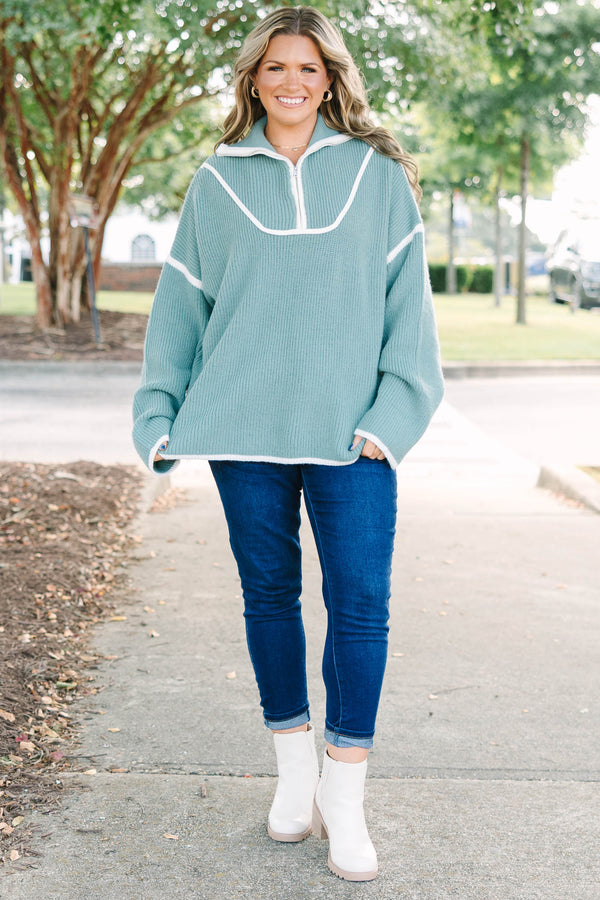 Plus Size olive green quarter-zip ribbed sweater with white trim and oversized fit.
