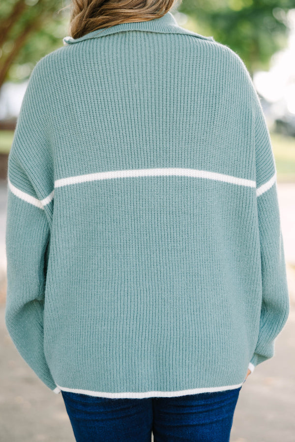 Plus Size olive green quarter-zip ribbed sweater with white trim and oversized fit.