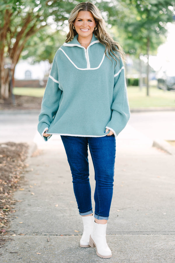 Plus Size olive green quarter-zip ribbed sweater with white trim and oversized fit.