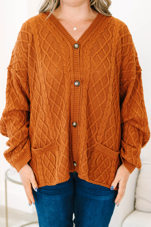 Plus Size brown cable knit cardigan with a V-neckline, button-front, and front pockets.