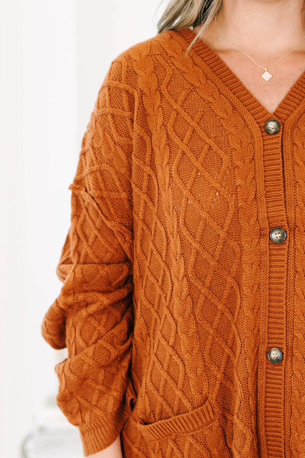 Plus Size brown cable knit cardigan with a V-neckline, button-front, and front pockets.
