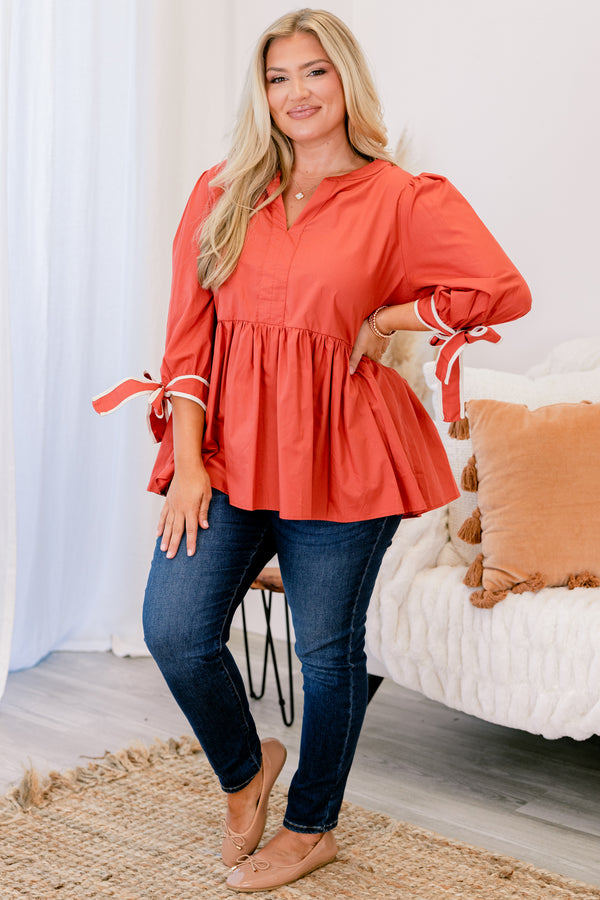Chic Soul plus size clothing, orange baby doll long sleeve top with a slight v-neckline and bows that tie at the end of each sleeve 
