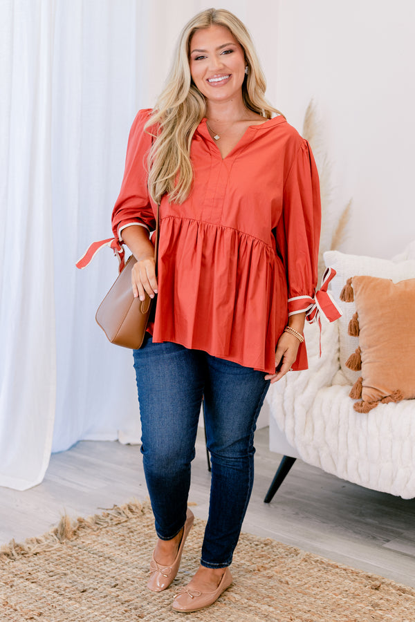 Chic Soul plus size clothing, orange baby doll long sleeve top with a slight v-neckline and bows that tie at the end of each sleeve 