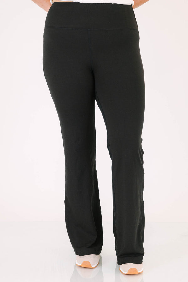 Plus Size black flare leggings in a butter soft fabric with a high-waisted fit.
