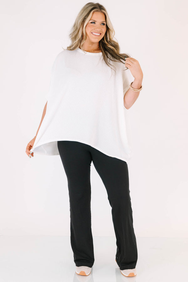 Plus Size black flare leggings in a butter soft fabric with a high-waisted fit.