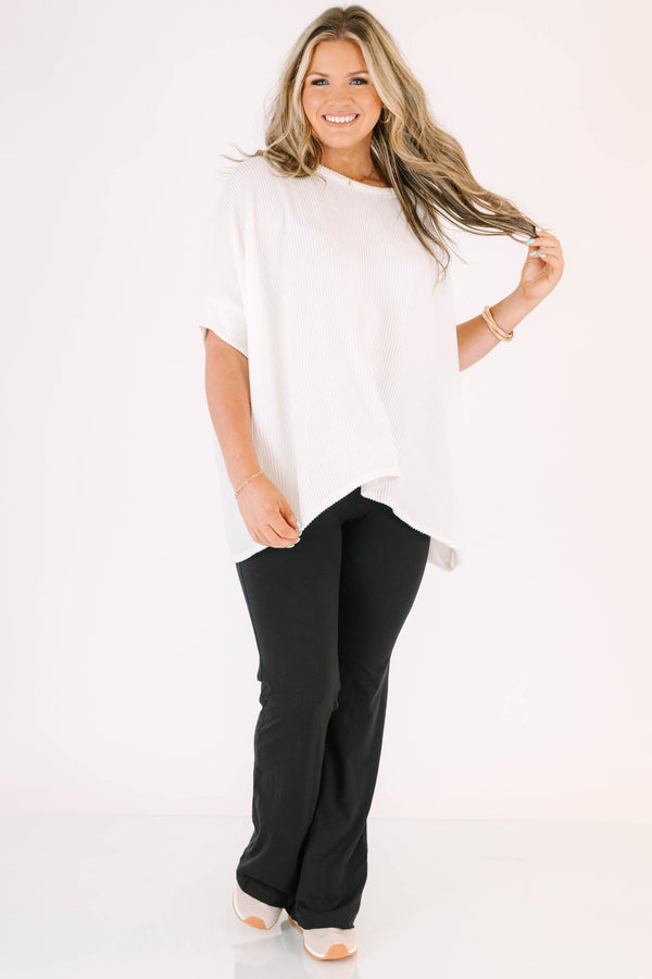Plus Size black flare leggings in a butter soft fabric with a high-waisted fit.