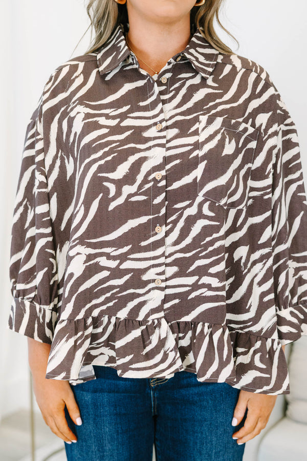 Plus size brown zebra print blouse with ruffled hemline, three quarter sleeves and functional buttons down front