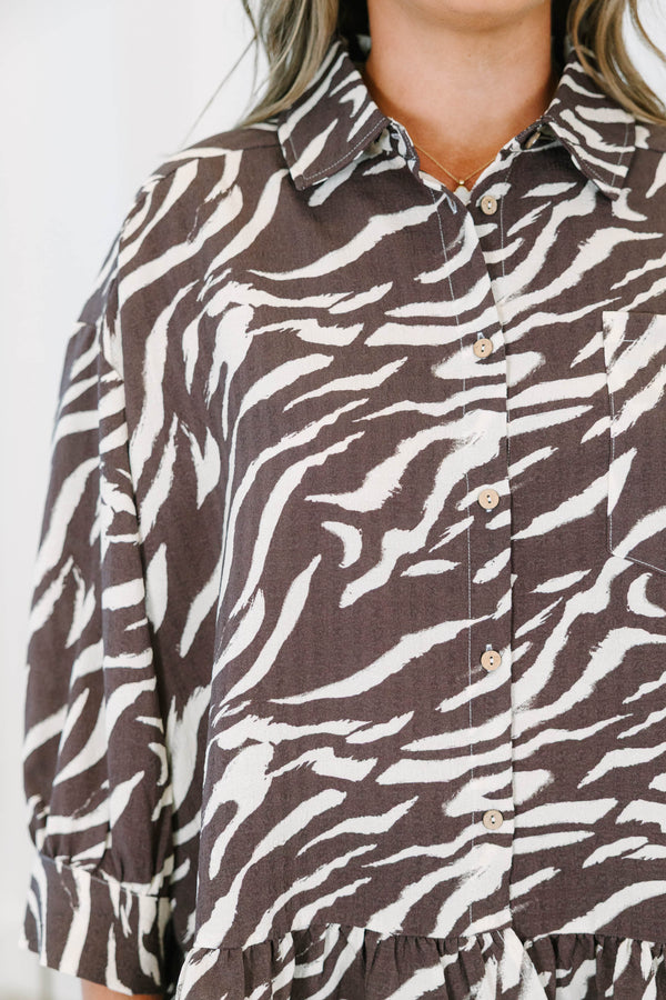 Plus size brown zebra print blouse with ruffled hemline, three quarter sleeves and functional buttons down front