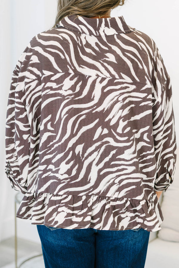 Plus size brown zebra print blouse with ruffled hemline, three quarter sleeves and functional buttons down front