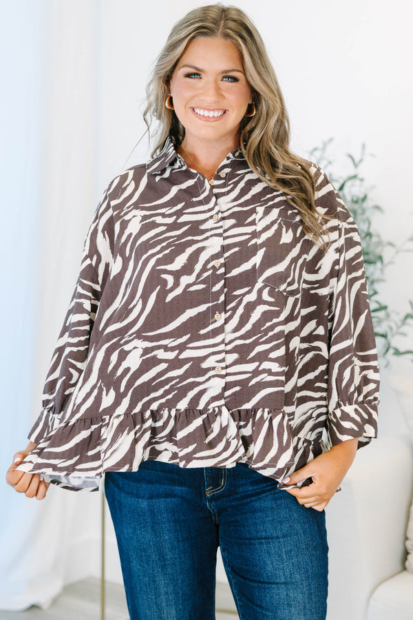 Plus size brown zebra print blouse with ruffled hemline, three quarter sleeves and functional buttons down front