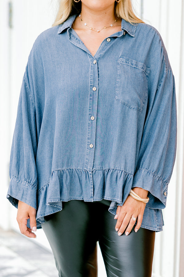 Chic Soul plus size clothing, denim long sleeve top with a pocket of the left side of the chest and a ruffle detail going along the bottom of the top 