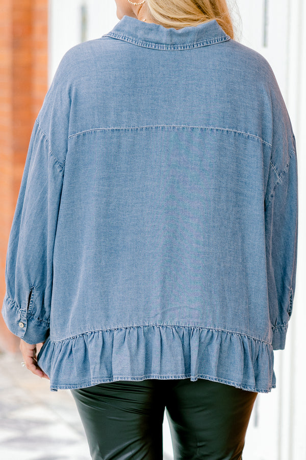 Chic Soul plus size clothing, denim long sleeve top with a pocket of the left side of the chest and a ruffle detail going along the bottom of the top 