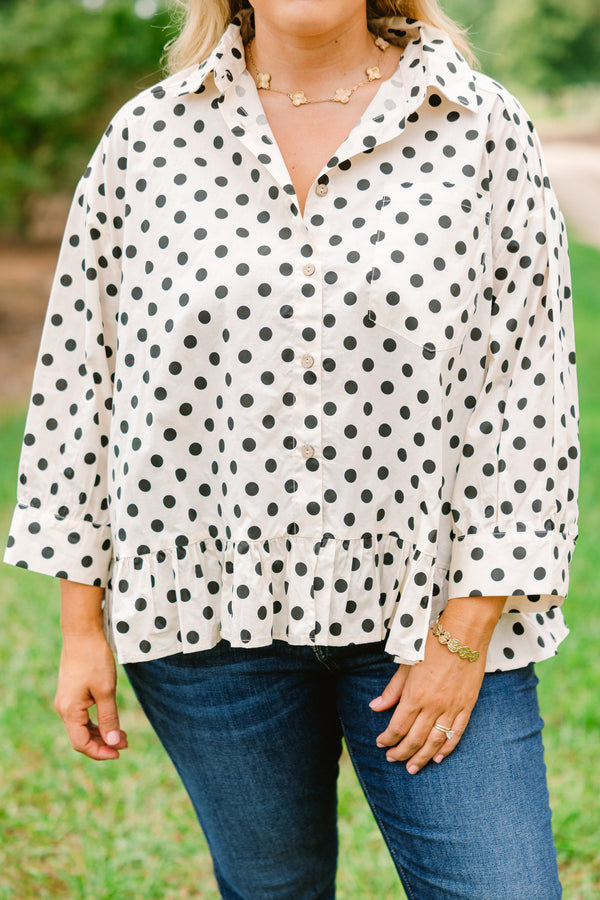 Chic Soul plus size clothing, cream long sleeve button up collared long sleeve blouse with black polka dots and a ruffle hem 
