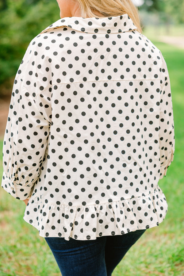 Chic Soul plus size clothing, cream long sleeve button up collared long sleeve blouse with black polka dots and a ruffle hem 
